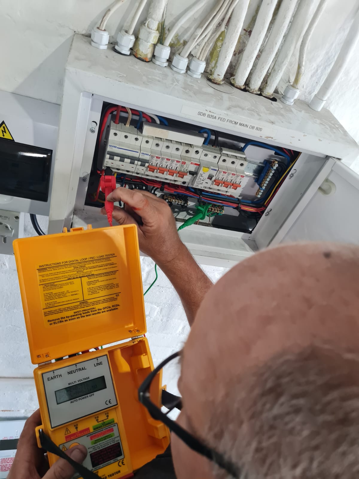 Loop and PSC testing being performed on the new distribution board
