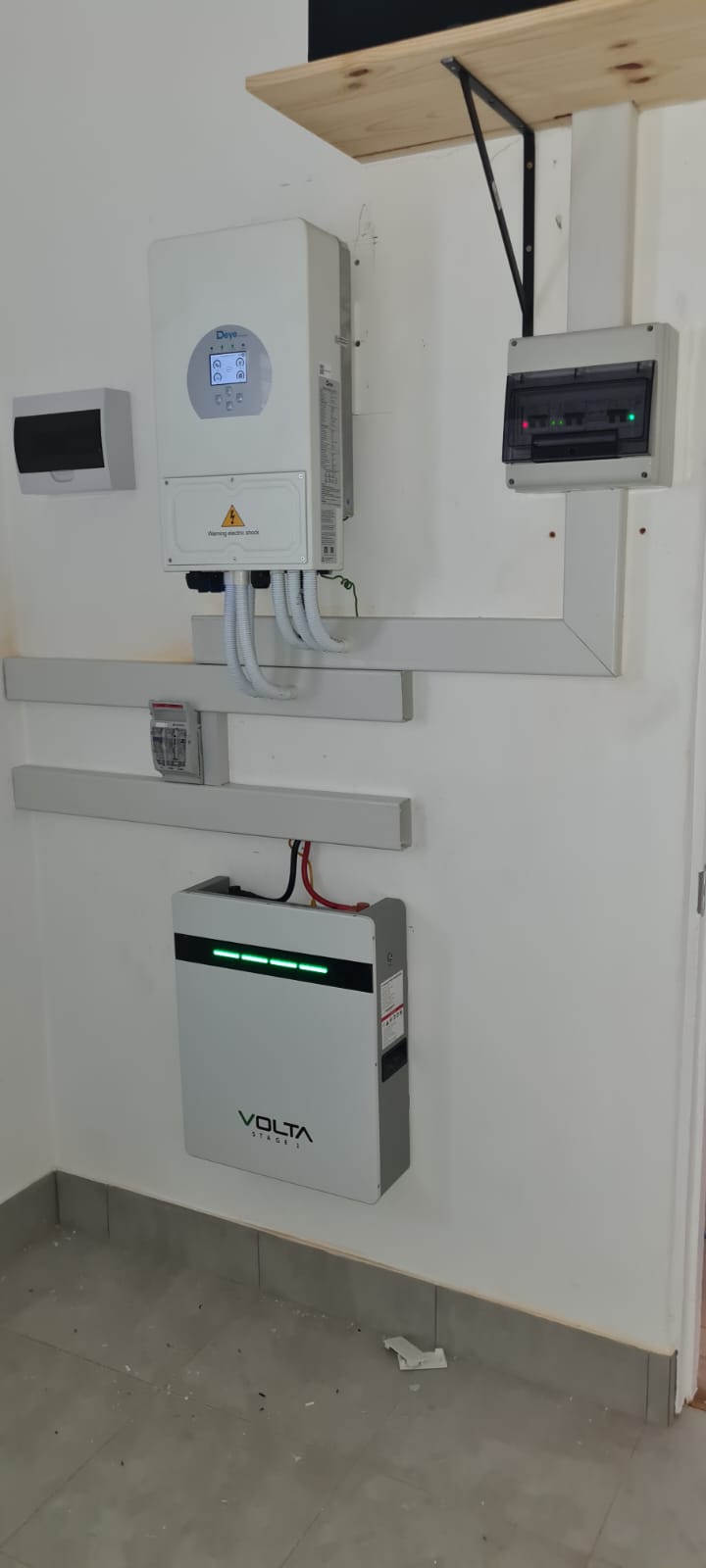 Deye inverter and Volta battery neatly wall-mounted with trunking and a small distribution board