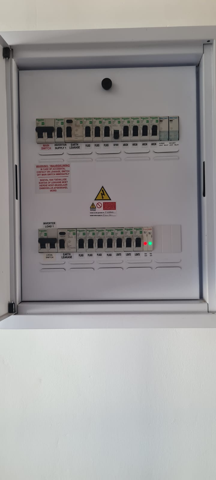Labelled distribution board with main switch, inverter supply, earth leakage and circuits for plugs, lights, aircon and gate motor