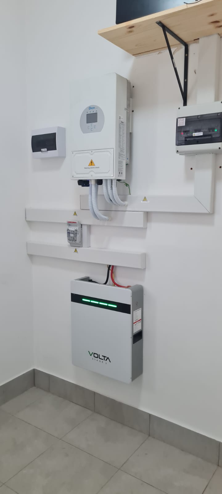 Wide view of the Deye inverter, Volta battery and cable trunking installation