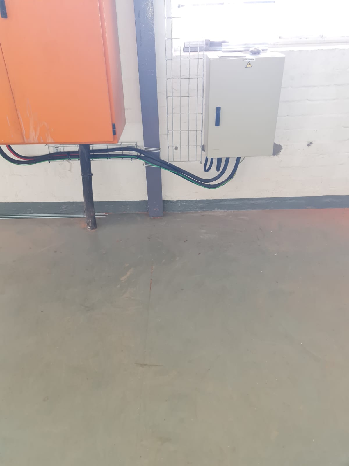 Neatly routed cabling and new distribution equipment installed for the cold rooms