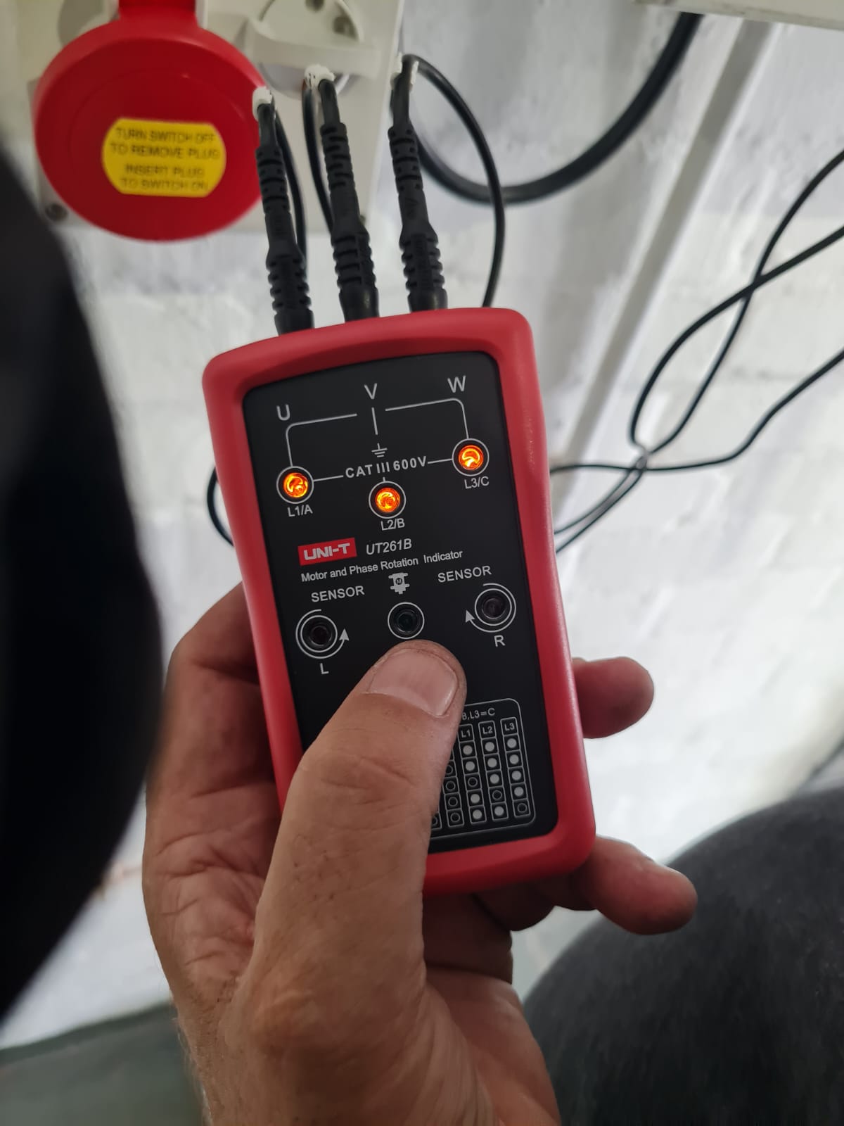 Phase rotation testing being carried out on the new three-phase installation