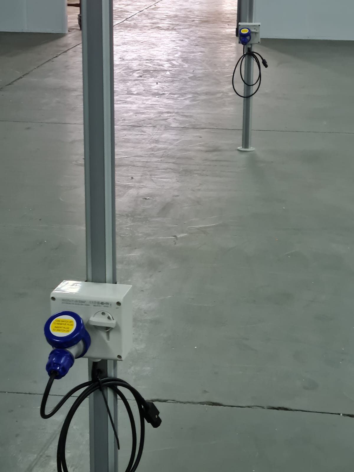 Waterproof blue industrial plug points installed on the packing floor