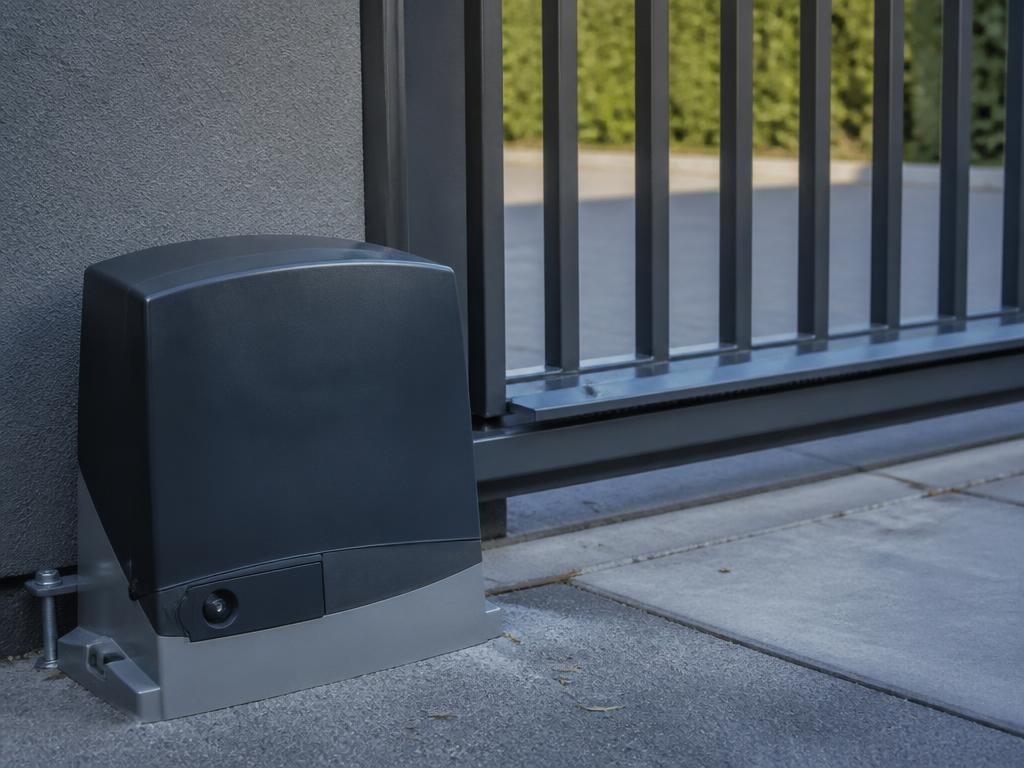 Sliding driveway gate with an electric gate motor