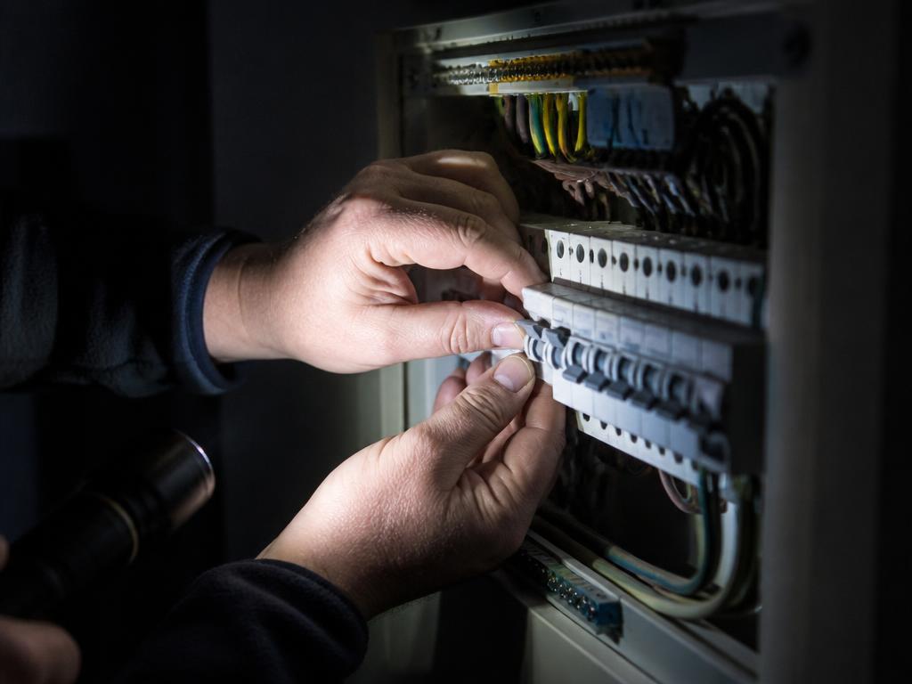 Electrician carrying out a scheduled maintenance check