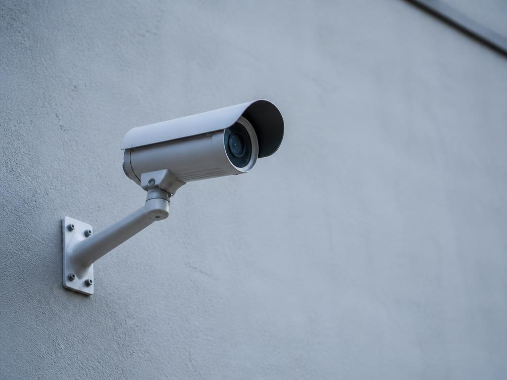 Electric fence and CCTV camera on a boundary wall